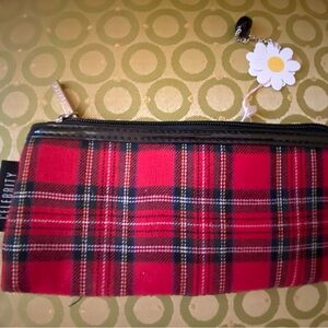 Celebrity plaid wristlet
